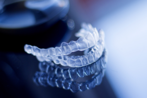 a close up of a pair of clear dental aligners